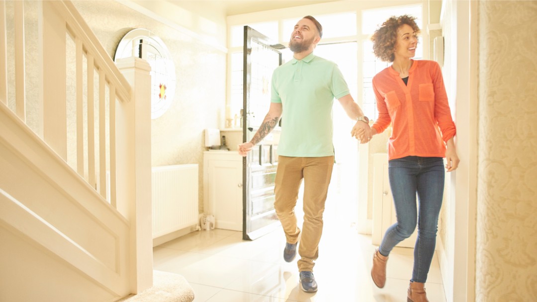 Couple Entering a house ready for a Murphy bed Austin | Wallbeds Austin